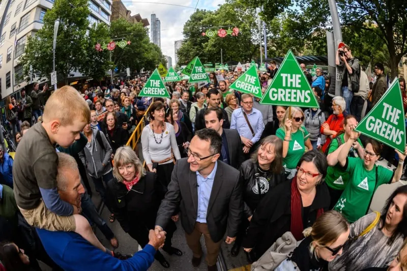 Greens supporters gathered with campaign signs