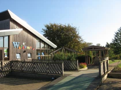 A picture of a sunny spacious exterior to an education center