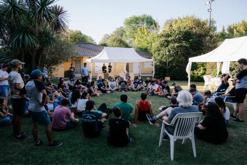 10Pines team members gathered in a circle outdoors