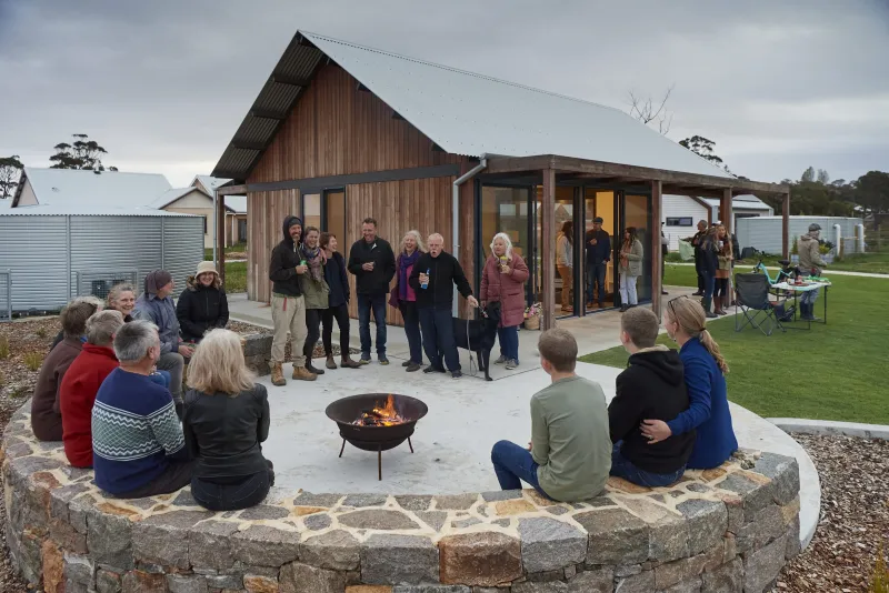 Witchcliffe residents gathered around a fire outside a community building