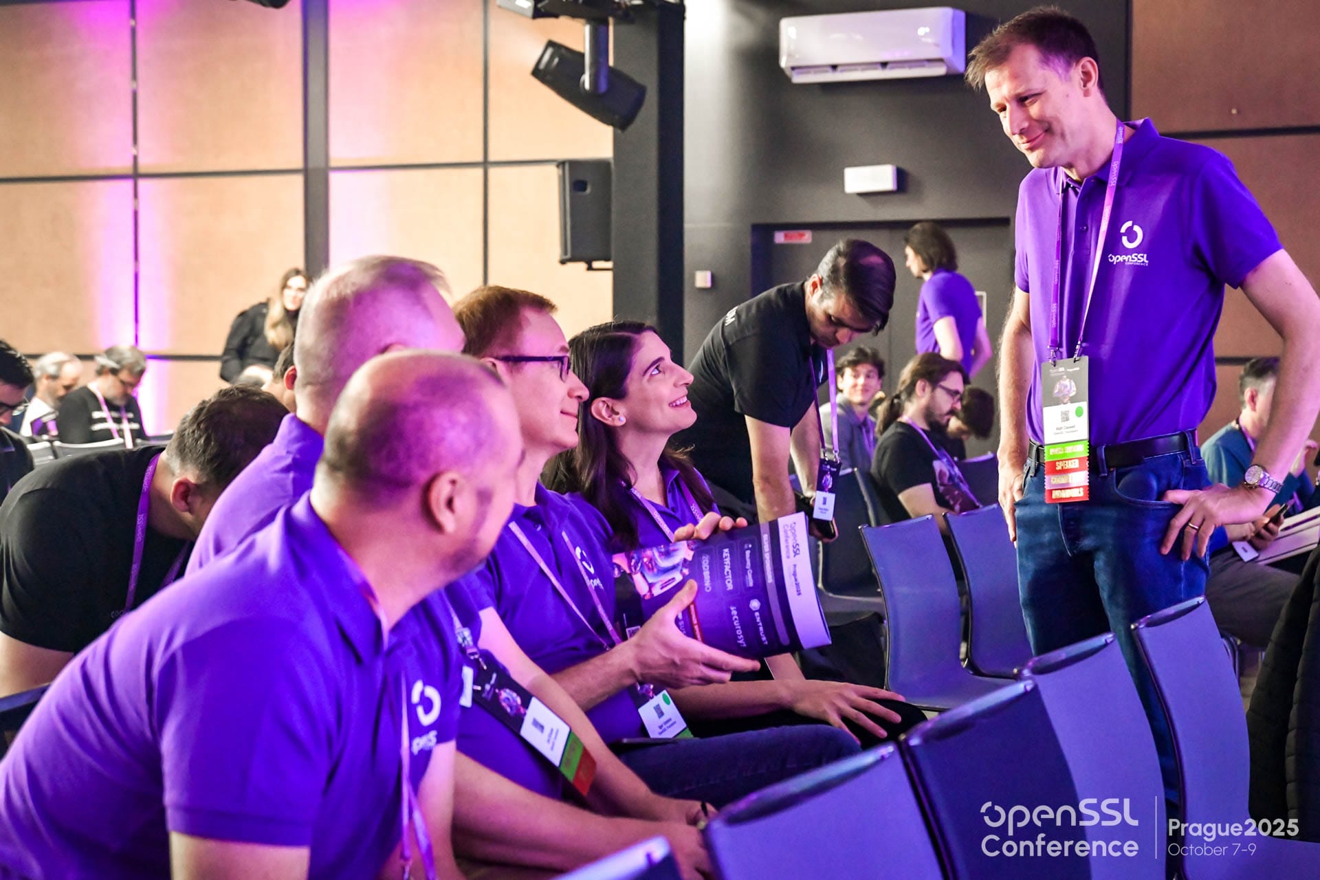 OpenSSL team members in conversation at the conference. Photo: OpenSSL Corporation