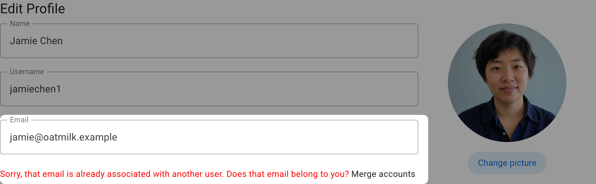 The Edit Profile page with the target account email and Merge accounts link highlighted